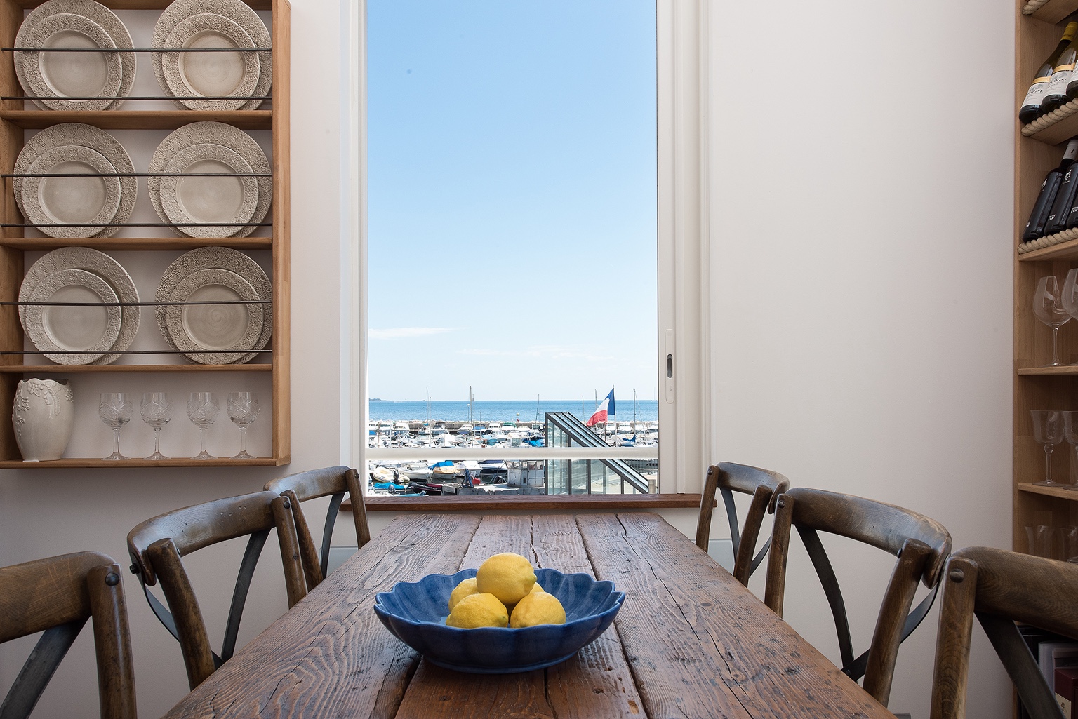 Dining table with lemon bowl and sea view